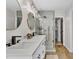 Bright bathroom with dual vanity, glass shower with rainfall shower head and walk-in closet at 107 Ivy Hollow Ct, Morrisville, NC 27560