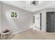 Simple bedroom features a window, a closet, neutral color palette, and carpet floors at 107 Ivy Hollow Ct, Morrisville, NC 27560