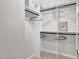 Organized walk-in closet with custom shelving and hanging rods for optimal storage at 107 Ivy Hollow Ct, Morrisville, NC 27560