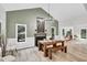 Inviting dining room features a fireplace, chandelier and wooden dining table at 107 Ivy Hollow Ct, Morrisville, NC 27560