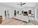 Bright living room featuring a ceiling fan, hardwood floors, and comfortable seating, creating an inviting atmosphere at 107 Ivy Hollow Ct, Morrisville, NC 27560