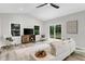 Inviting living room with sliding glass doors, hardwood floors, and modern furnishings for relaxed living and entertaining at 107 Ivy Hollow Ct, Morrisville, NC 27560