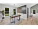 Home office with natural light, a modern desk, and decorative wall art at 107 Ivy Hollow Ct, Morrisville, NC 27560