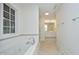 Bright bathroom with a large tub and shower, tile flooring, and a double vanity at 107 Silo Dr, Chapel Hill, NC 27514
