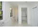 Bright bathroom with modern fixtures, tiled walk-in shower, and convenient safety bars at 107 Silo Dr, Chapel Hill, NC 27514