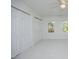 Bright bedroom features carpeting, windows, and plentiful closet space at 107 Silo Dr, Chapel Hill, NC 27514