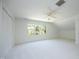 Spacious bedroom with neutral walls and carpet with bright light from the three windows at 107 Silo Dr, Chapel Hill, NC 27514