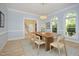 Elegant dining room offers natural light, classic decor, and hardwood flooring at 107 Silo Dr, Chapel Hill, NC 27514