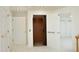 Hallway featuring a home elevator with carpeting and doorways leading to bedrooms at 107 Silo Dr, Chapel Hill, NC 27514