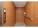 Interior view of residential elevator featuring wood paneling and safety features at 107 Silo Dr, Chapel Hill, NC 27514