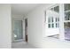 Bright hallway with a view of the outdoors, showcasing a charming transition space at 107 Silo Dr, Chapel Hill, NC 27514