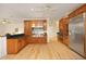 Gourmet kitchen with stainless steel appliances, wooden cabinets, and an open layout perfect for entertaining at 107 Silo Dr, Chapel Hill, NC 27514