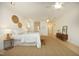 Bright main bedroom features hardwood floors, modern ceiling fans, and decorative wall art at 107 Silo Dr, Chapel Hill, NC 27514