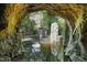 Beautiful pond scene with a structure surrounded by rock landscaping and reflections, creating a tranquil atmosphere at 107 Silo Dr, Chapel Hill, NC 27514