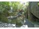 A stunning dragon sculpture integrated into a rock formation, adding artistry to the landscape at 107 Silo Dr, Chapel Hill, NC 27514