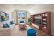 Cozy bonus room with large window, media cabinet, and plush seating at 11 Little Gem Ln, Fuquay Varina, NC 27526