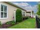 Well-maintained backyard with lawn, tasteful landscaping, and a covered patio, great for outdoor living at 112 Tanoak Ct, Durham, NC 27703