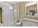 Cozy bathroom with a shower-tub, vanity, and charming decorative touches at 112 Tanoak Ct, Durham, NC 27703