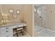 Elegant bathroom featuring a vanity with granite counters and glass shower enclosure at 112 Tanoak Ct, Durham, NC 27703
