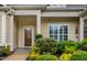 Inviting front entrance with decorative bushes and trimmed bushes at 112 Tanoak Ct, Durham, NC 27703