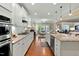 Spacious kitchen with granite countertops, a large island, and stainless steel appliances at 112 Tanoak Ct, Durham, NC 27703