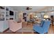 Open-concept living room featuring fireplace, custom built-ins, and hardwood floors at 112 Tanoak Ct, Durham, NC 27703