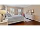Inviting main bedroom with hardwood floors, shutters, and coordinated decor at 112 Tanoak Ct, Durham, NC 27703