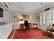 Office area featuring a traditional desk, bookshelves, and a decorative American flag at 112 Tanoak Ct, Durham, NC 27703