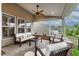 Cozy covered patio featuring a ceiling fan and comfortable seating area at 112 Tanoak Ct, Durham, NC 27703