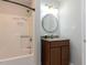 Updated bathroom with a vanity, granite countertop and tub with shower at 113 Honeysuckle Ln, Durham, NC 27703