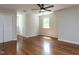 Spacious bedroom featuring beautiful hardwood floors and a ceiling fan at 113 Honeysuckle Ln, Durham, NC 27703