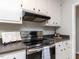 Close-up of the kitchen, showcasing stainless steel stove and countertops at 113 Honeysuckle Ln, Durham, NC 27703