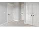 This bedroom features white doors, neutral walls, and soft carpet flooring throughout at 113 Windy Creek Ln, Apex, NC 27502