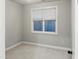 This well-lit bedroom features neutral walls, soft carpet flooring, and a window with blinds at 113 Windy Creek Ln, Apex, NC 27502