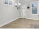 Bright dining area with stylish flooring and ample natural light at 113 Windy Creek Ln, Apex, NC 27502