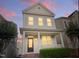 Charming two-story home features a welcoming porch and manicured landscaping at 113 Windy Creek Ln, Apex, NC 27502