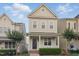 Attractive home with a charming porch, complemented by lush green landscaping at 113 Windy Creek Ln, Apex, NC 27502