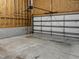 Clean garage interior with bare walls and concrete floor at 113 Windy Creek Ln, Apex, NC 27502