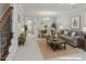 Bright and airy living room with dining area, perfect for entertaining guests at 113 Windy Creek Ln, Apex, NC 27502