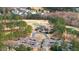 An aerial view of the community clubhouse, golf course, and surrounding homes provides a picturesque neighborhood setting at 1132 Heritage Knoll Dr, Wake Forest, NC 27587