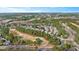 An aerial view showcases the homes nestled amongst a lush green landscape and golf course community at 1132 Heritage Knoll Dr, Wake Forest, NC 27587