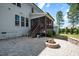 Backyard featuring a stone patio with built in fire pit and screened in porch at 1132 Heritage Knoll Dr, Wake Forest, NC 27587