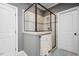 Bathroom with glass enclosed shower with tiled walls, shower head and bench at 1132 Heritage Knoll Dr, Wake Forest, NC 27587