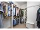Walk-in closet featuring multiple hanging racks, shelves, and storage bench at 1132 Heritage Knoll Dr, Wake Forest, NC 27587