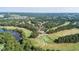 An aerial image shows the golf course with surrounding trees and an elegant clubhouse at 1132 Heritage Knoll Dr, Wake Forest, NC 27587