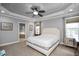 Spacious main bedroom with trey ceiling, adjoining bathroom, and plenty of natural light at 1132 Heritage Knoll Dr, Wake Forest, NC 27587