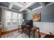 Stylish office with a coffered ceiling, wainscoting, and large windows at 1132 Heritage Knoll Dr, Wake Forest, NC 27587