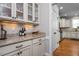 Pantry with granite countertops, cabinets, and easy access to the kitchen at 1132 Heritage Knoll Dr, Wake Forest, NC 27587