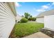 Landscaped backyard with green grass and view of neighboring homes at 11340 Involute Pl # 100, Raleigh, NC 27617