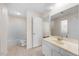 Bathroom with a single sink vanity, tile flooring, and a shower-tub combo at 11340 Involute Pl # 100, Raleigh, NC 27617